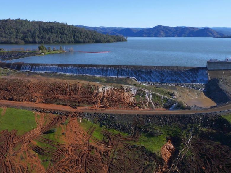 Water flows over the emergency spillway at Lake Oroville on Feb. 11, 2017.